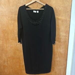 Sweater dress with detailed neckline